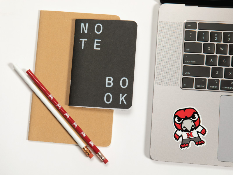 Notebook, laptop, pencil, and swoop.