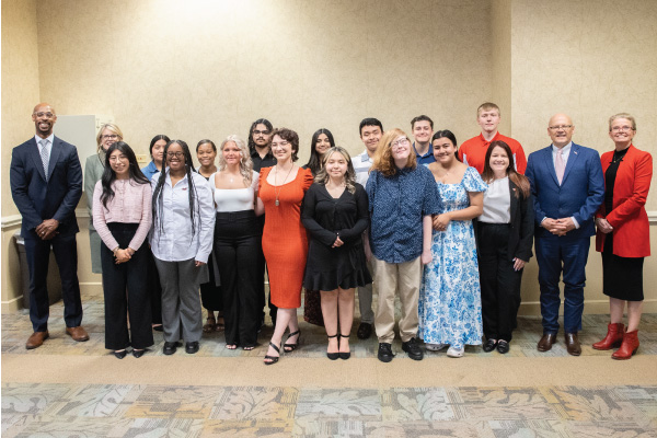 2024 graduating cohort of ECA students at a reception hosted by President Greg Crawford