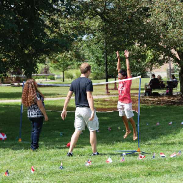 Students playing volleyball in the quad of the Hamilton campus.