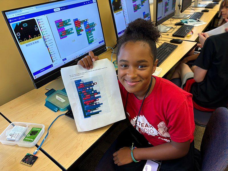 A STEAM Studio camper learning how to test chemical compounds 