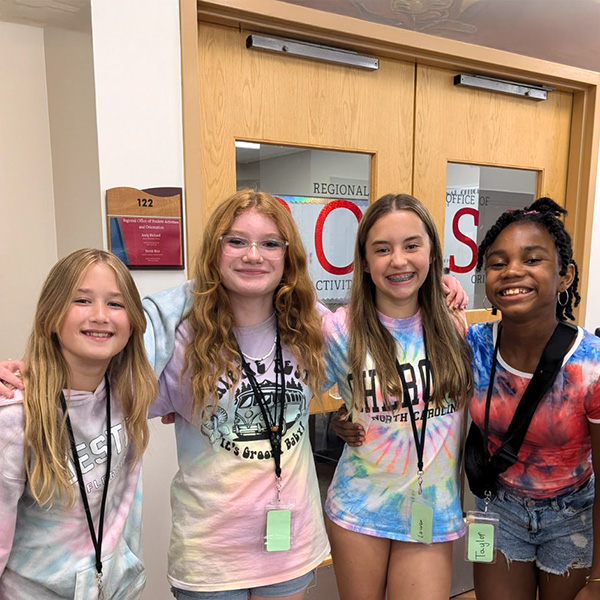 Young women campers smiling