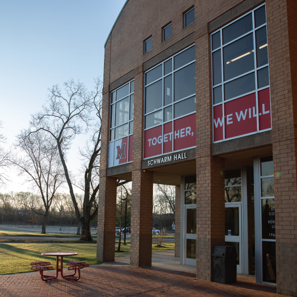 Hamilton Campus schwarm hall exterior with Together, We Will branding.