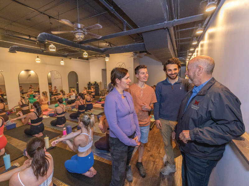 David Riggs, Director of the Ohio SBDC talking with a fitness with members of Fitness on High in Oxford, OH. 
