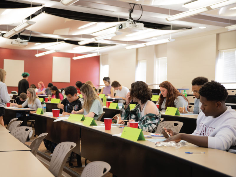 ART 188 class actively painting.