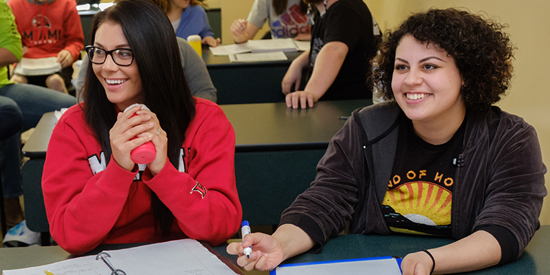 Two female students in the classroom