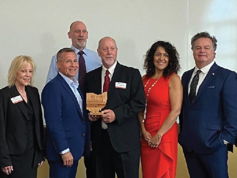 Front row from L to R: Holly Schultheis, Grants and Communications manager SBDC Everett Woodell, SBA Director Columbus District David Riggs, Director SBDC Karla Boldery, Business Adviser SBDC Tim Bingaman, Business Adviser SBDC Back row: James Buckner, Associate Director SBDC