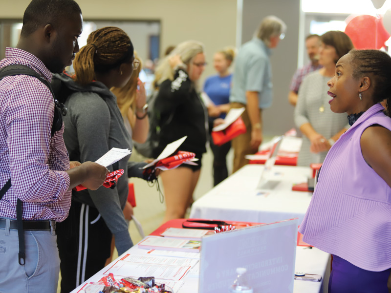 Student talking with a faculty member about a major.