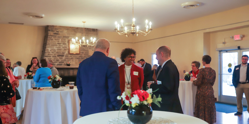People socializing in the Verity Lodge front room.