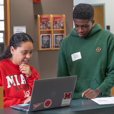 students looking at a laptop